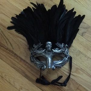 Costume mask with black feathers, ties with ribbon